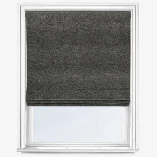 Charcoal gray Roman blind in a white window frame