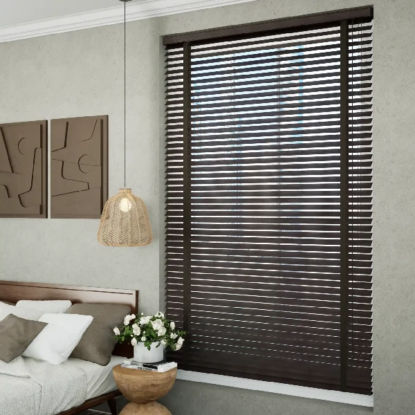 Modern bedroom featuring dark motorized wooden blinds on a large window