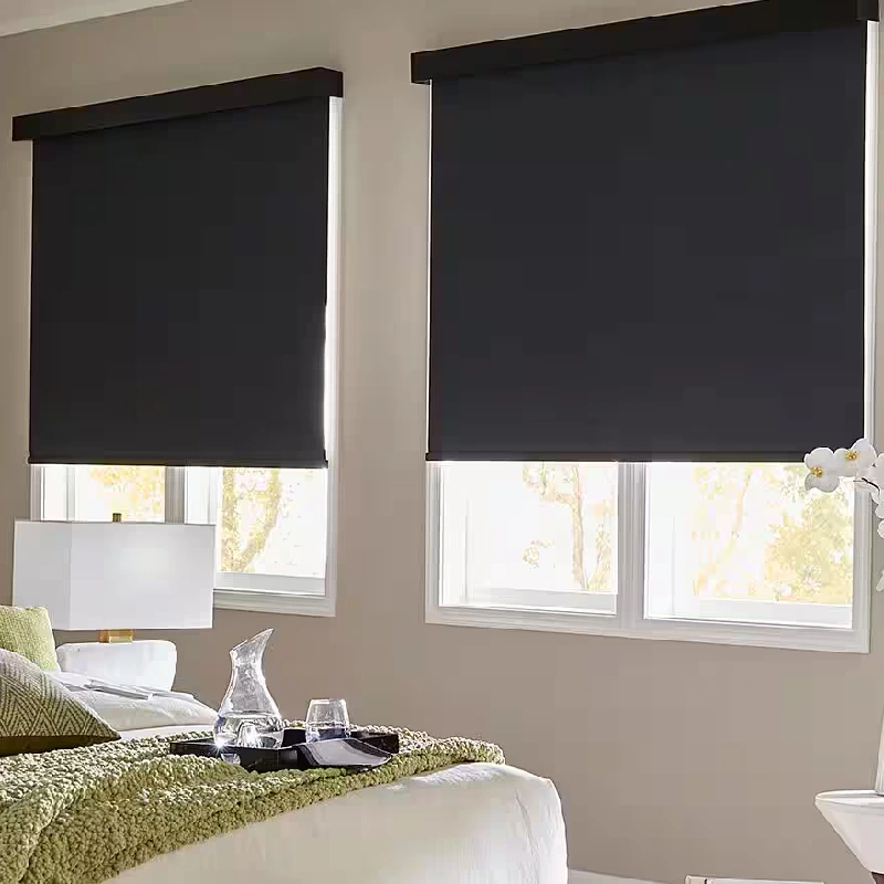 black motorized roller blinds partially covering white-framed windows